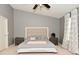 Cozy bedroom featuring a ceiling fan, stylish headboard, and ample natural light at 2336 Boneset Dr, Plainfield, IN 46168