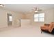 Spacious bonus room features neutral carpet, ceiling fan and a window with natural light at 2336 Boneset Dr, Plainfield, IN 46168