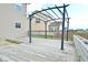 Spacious wooden deck with a metal pergola, offering a charming outdoor living area at 2336 Boneset Dr, Plainfield, IN 46168