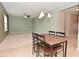 Dining area features tile floors with a table and chairs, transitioning into a carpeted living space at 2336 Boneset Dr, Plainfield, IN 46168