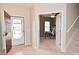 Foyer with tile entry, coat closet, and office space located off the entry at 2336 Boneset Dr, Plainfield, IN 46168