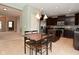 Well-lit kitchen featuring an island, modern appliances, and an adjacent dining area at 2336 Boneset Dr, Plainfield, IN 46168