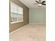 Spacious living room with neutral carpet, a ceiling fan, and a window for ample natural light at 2336 Boneset Dr, Plainfield, IN 46168