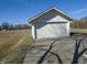 Exterior of a one-car garage with a white door and long driveway at 2860 S Meridian St, Indianapolis, IN 46225
