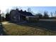 Rustic barn with a covered porch and well-maintained grounds, adding charm to the property at 2913 W Broderie Ln, Monrovia, IN 46157