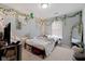 A charming bedroom is decorated with string lights, wall vines, and a cozy bed in a well-lit space at 2913 W Broderie Ln, Monrovia, IN 46157