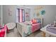 A cute bedroom with a white bed frame, pastel bedding, and playful decorations for a cozy and personalized space at 2913 W Broderie Ln, Monrovia, IN 46157