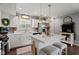 Bright kitchen with white cabinets, stainless appliances, and a central island with barstool seating at 2913 W Broderie Ln, Monrovia, IN 46157