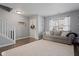 Bright living area featuring a comfortable couch, large window, and hardwood floors at 2913 W Broderie Ln, Monrovia, IN 46157