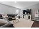 Comfortable living room with plush seating, a large TV, and modern decor at 2913 W Broderie Ln, Monrovia, IN 46157