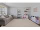Cozy living room with neutral tones, plush carpet, and stylish decor at 2913 W Broderie Ln, Monrovia, IN 46157