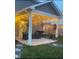 Cozy covered patio with string lights and comfortable seating, perfect for evening relaxation and entertaining at 2913 W Broderie Ln, Monrovia, IN 46157