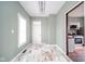 Entryway with marble patterned floors, green walls, and white door at 300 E North Main St, Summitville, IN 46070