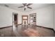 Open living room featuring hardwood floors, fireplace, and entry to kitchen at 300 E North Main St, Summitville, IN 46070