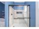 Bathroom shower featuring glass door, tiled walls and modern fixtures at 300 E North Main St, Summitville, IN 46070