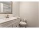 Modern bathroom featuring a vanity, toilet, and shower with glass doors at 3278 Oceanline E Dr, Indianapolis, IN 46214