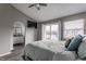 Spacious bedroom featuring a balcony, ceiling fan, tv, and en suite bathroom with double sink vanity at 3278 Oceanline E Dr, Indianapolis, IN 46214