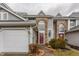 Exterior view of home with attached garage and well-maintained landscaping at 3278 Oceanline E Dr, Indianapolis, IN 46214