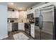 Kitchen with stainless steel appliances, white cabinetry, and granite countertops and island at 3278 Oceanline E Dr, Indianapolis, IN 46214
