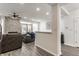 Comfortable living room with a stacked stone fireplace, ceiling fan, and an open concept layout at 3278 Oceanline E Dr, Indianapolis, IN 46214