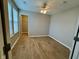 Bedroom featuring hardwood flooring, neutral wall colors, and a closet at 3408 Village Dr, Anderson, IN 46011