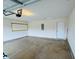 A clean, spacious garage with an automatic door opener and ample room for storage and parking at 3408 Village Dr, Anderson, IN 46011