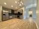 Bright kitchen featuring stainless appliances, stylish cabinets, and granite counters at 3408 Village Dr, Anderson, IN 46011