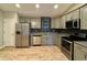 Modern kitchen with stainless steel appliances and granite countertops at 3408 Village Dr, Anderson, IN 46011