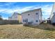 Spacious backyard with a patio, fire pit, and plenty of room for outdoor activities at 3423 Shadow Bend Dr, Columbus, IN 47201