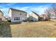 Large backyard with a view of the home and patio area, great for outdoor living at 3423 Shadow Bend Dr, Columbus, IN 47201