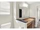 Well-lit bathroom featuring a modern vanity with granite countertops at 3423 Shadow Bend Dr, Columbus, IN 47201