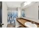 Bathroom featuring a granite countertop vanity and shower with stylish curtain at 3423 Shadow Bend Dr, Columbus, IN 47201