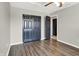 Bedroom with laminate floors and a closet and doorways with black trim at 3423 Shadow Bend Dr, Columbus, IN 47201