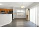 Bright dining area with dark wood floors located just off the kitchen at 3423 Shadow Bend Dr, Columbus, IN 47201