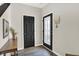 Bright entryway featuring stylish wood floors, decorative glass door, and convenient mail organizer at 3423 Shadow Bend Dr, Columbus, IN 47201