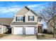 Charming two-story home with a two-car garage and manicured lawn, perfect for a growing Gathering at 3423 Shadow Bend Dr, Columbus, IN 47201