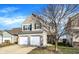 Charming two-story home with a brick facade, two-car garage, and well-manicured lawn at 3423 Shadow Bend Dr, Columbus, IN 47201
