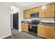 Updated kitchen with stainless steel appliances, sleek countertops, and ample cabinetry for storage at 3423 Shadow Bend Dr, Columbus, IN 47201