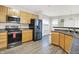Well-lit kitchen with stainless steel appliances, ample counter space, and eat in kitchen at 3423 Shadow Bend Dr, Columbus, IN 47201