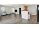 Open concept living room with gray sofa and dark wood floors at 3423 Shadow Bend Dr, Columbus, IN 47201
