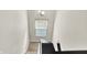 Bright staircase with a large window and contemporary lighting at 3423 Shadow Bend Dr, Columbus, IN 47201