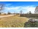 Well-maintained yard with a wooden fence and a charming brick fire pit, ideal for gatherings at 3423 Shadow Bend Dr, Columbus, IN 47201