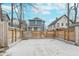 Spacious backyard featuring a large concrete patio area surrounded by a wooden privacy fence at 3550 N Illinois St, Indianapolis, IN 46208