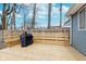 Wooden deck with built-in seating and a grill, ideal for outdoor entertaining at 3550 N Illinois St, Indianapolis, IN 46208