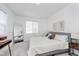 Bright bedroom featuring a comfortable bed, neutral tones, modern decor, and ample natural light for a relaxing atmosphere at 3550 N Illinois St, Indianapolis, IN 46208
