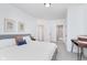 Bright main bedroom features a comfortable bed, neutral tones, modern decor, and an en-suite bathroom at 3550 N Illinois St, Indianapolis, IN 46208