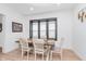 Bright dining area features modern decor, wood flooring, and a table with seating for six, perfect for Gathering meals at 3550 N Illinois St, Indianapolis, IN 46208