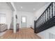 Welcoming foyer with modern staircase and neutral tones, offering a bright and inviting entrance to the home at 3550 N Illinois St, Indianapolis, IN 46208