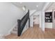 Hallway boasts modern staircase and neutral tones, offering a bright and inviting entrance to the home at 3550 N Illinois St, Indianapolis, IN 46208