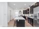 Well-lit kitchen with black cabinets, white countertops, and an island with seating at 3550 N Illinois St, Indianapolis, IN 46208